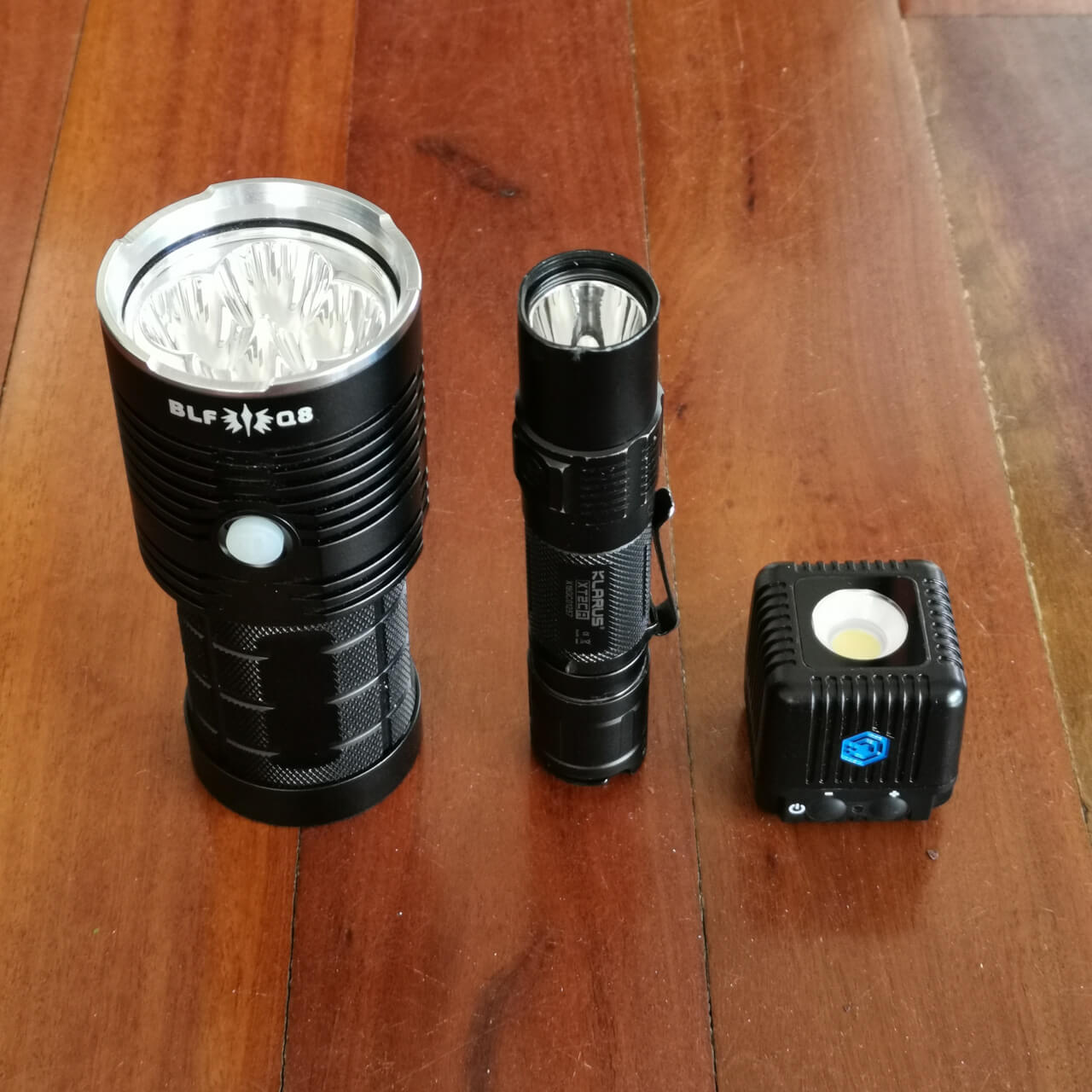 LumeCube 2.0 size compared to a 5,000lm Thorfire Q8 and 1,600lm Klarus XT2CR